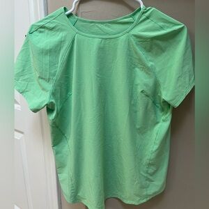 Lululemon light weight top with reflectors. Size 6. Hardly worn.